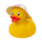 Yellow rubber duck wearing a straw hat with a pink bow on a white background