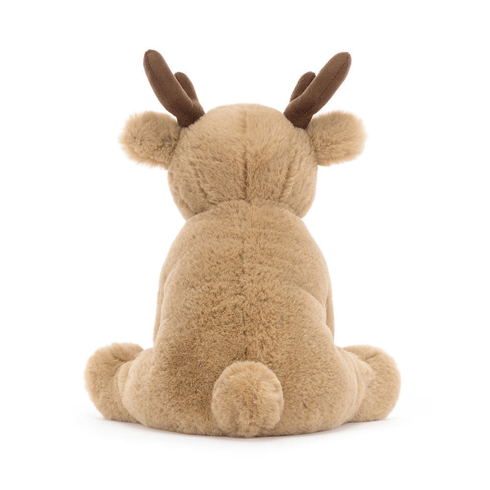 Plush reindeer toy on a white background