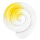Close-up of a glass orb with yellow and white swirl pattern on a white background