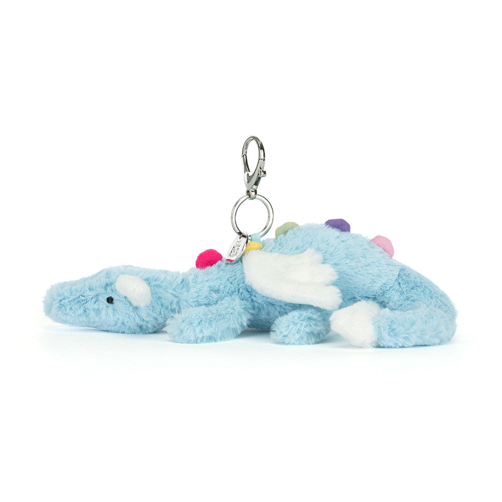 Plush blue dinosaur keychain with colorful accents on a white background