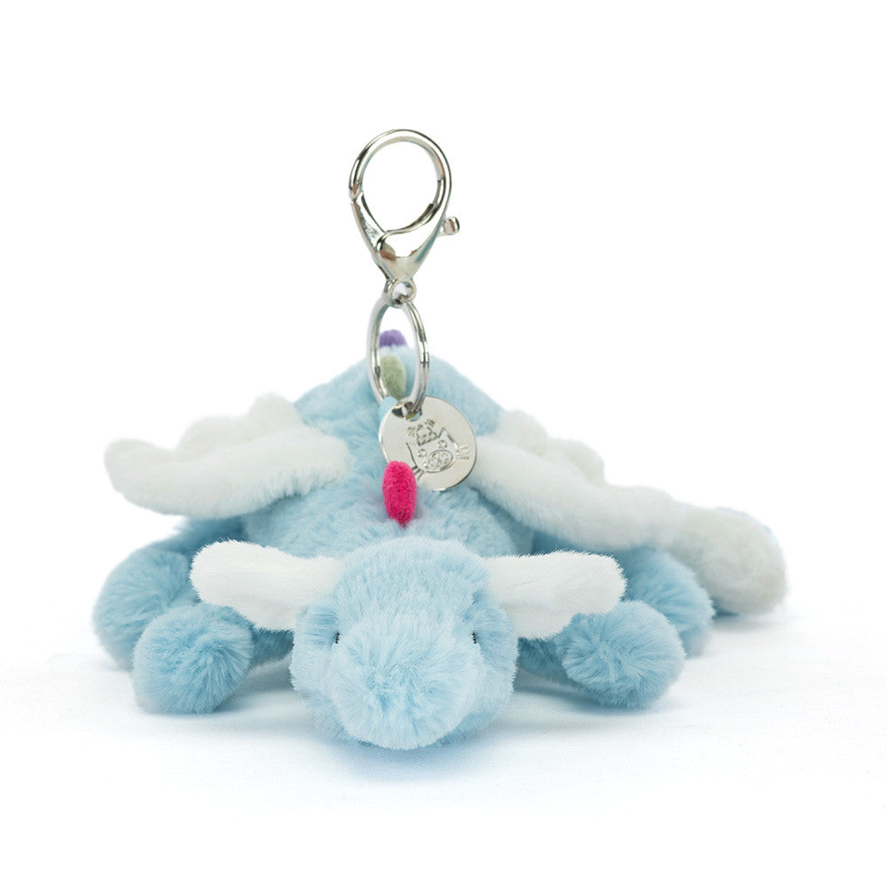 Blue plush bunny keychain with a tag on a white background