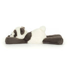 Plush panda toy lying on a white background