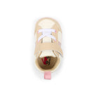 Gold high-top sneaker with white laces on a white background