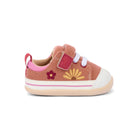 A toddler's pink suede sneaker with a white rubber toe cap and sole, featuring a pink pull tab, hook-and-loop strap closure, embroidered pink and yellow flowers, and a thin pink stripe on the side.