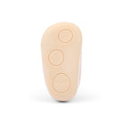 The beige rubber outsole of a baby bootie, showing embossed size and shape indicators, photographed on a clean white background.