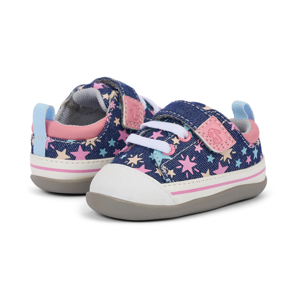 Pair of children's sneakers with star pattern on a white background