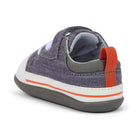 Children's shoe with gray, white, and orange design on a white background