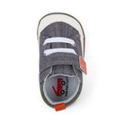 Gray baby shoe with white laces on a white background