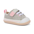 A baby sneaker with a light gray herringbone canvas upper, a light pink velcro strap and pull tab, a white rubber toe cap, and a beige sole, shown on a white background.