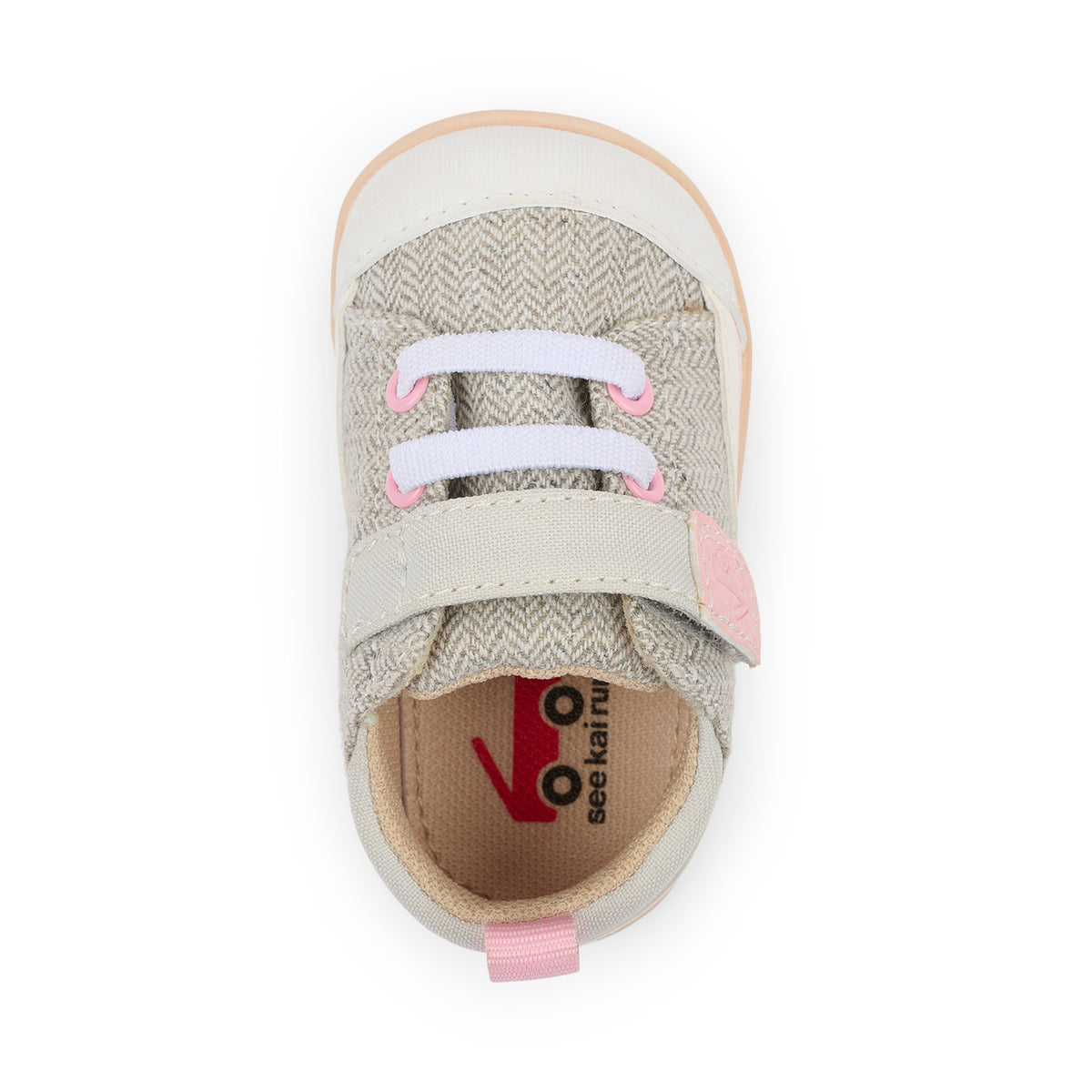 Children's shoe with pink laces and visible brand logo on a white background