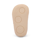 Beige shoe insole with embossed designs on a white background