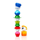 SmartMax My First People magnetic pieces stacked vertically into a tall tower with a chef head on top and a separate construction worker figure standing beside it against a white background.
