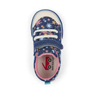 Navy blue shoe with star pattern and pink interior on a white background