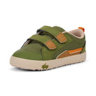 Green children's shoe with brown accents on a white background