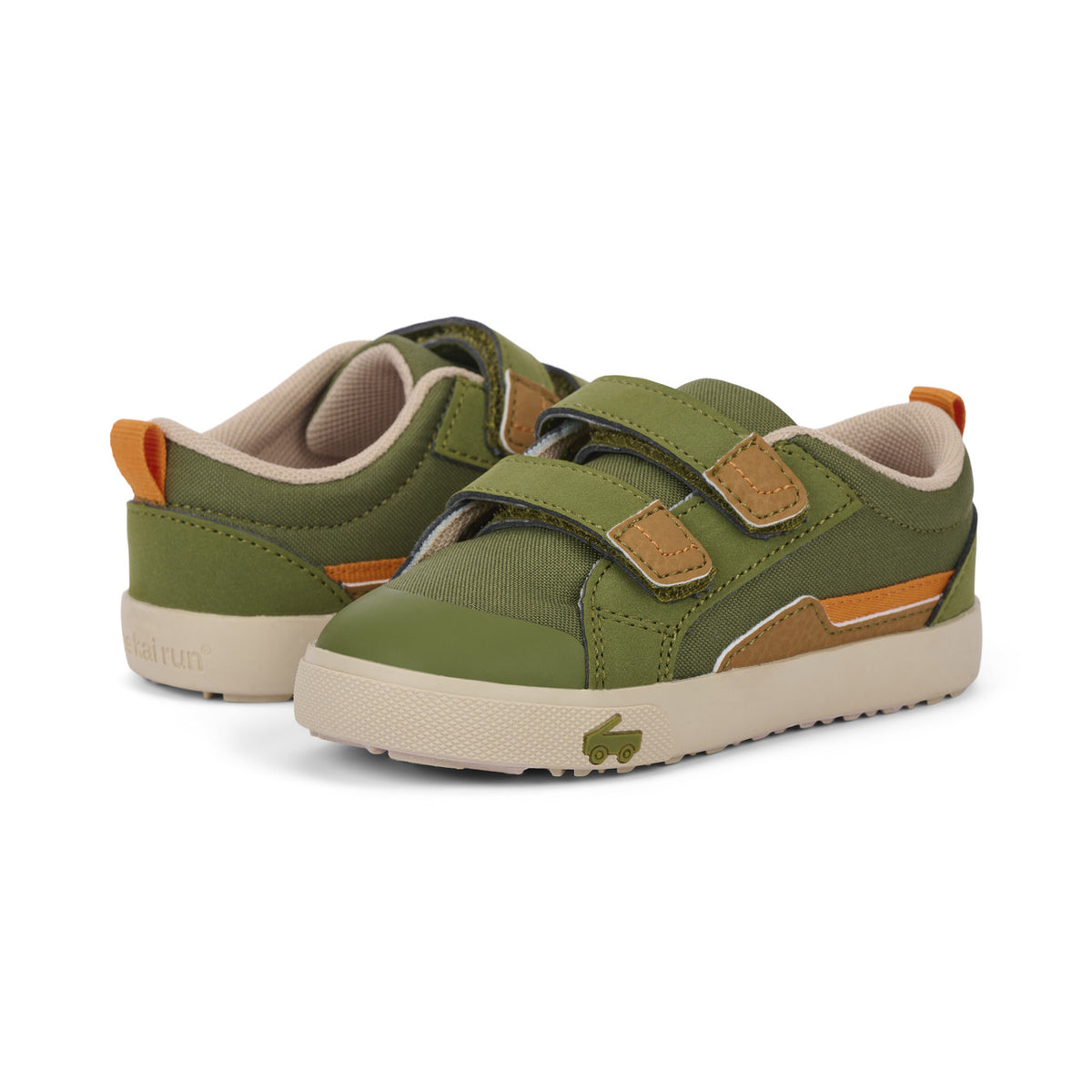 Green children's sneakers with brown accents on a white background