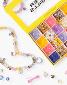 Colorful beaded jewelry set with a box of beads on a white background
