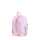 A light pink backpack shown from the back, featuring padded shoulder straps, a top carry handle, and a side pocket decorated with a colorful sprinkle pattern, set against a plain white background.