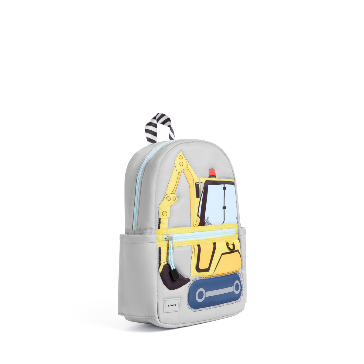 A light gray backpack featuring a large yellow excavator illustration on the front pocket, with a black-and-white striped top handle, shown on a plain white background.