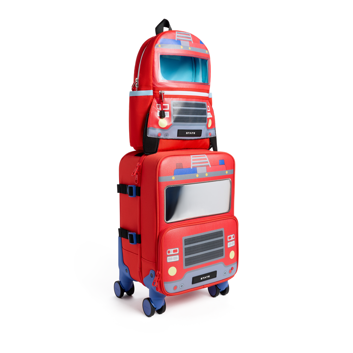 Two red State Bags Mini Logan carry-on suitcases stacked vertically, designed to look like firetrucks, featuring blue telescopic handles, 360-degree spinner wheels, and front graphic details including headlights, grilles, and windshields.