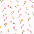 Pattern of pink and yellow tulips on a white background