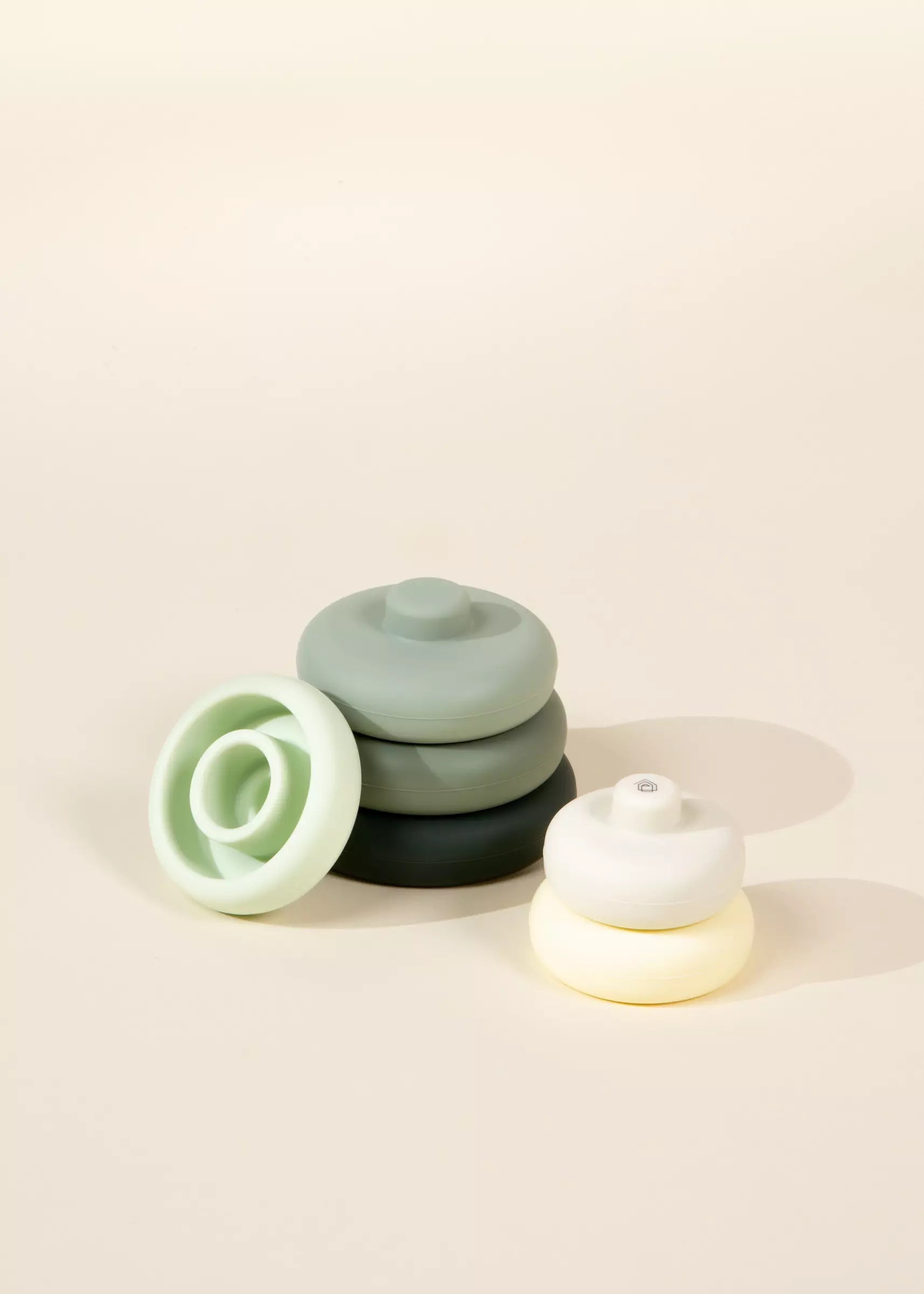 Set of small ceramic pots on a beige background