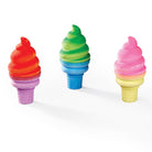 Three colorful ice cream cone-shaped erasers on a white background