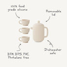 Product feature infographic for the Mushie silicone tea play set, highlighting that it is made from 100% food-grade silicone, is BPA, BPS, PVC, and phthalate-free, dishwasher safe, and features a removable lid.