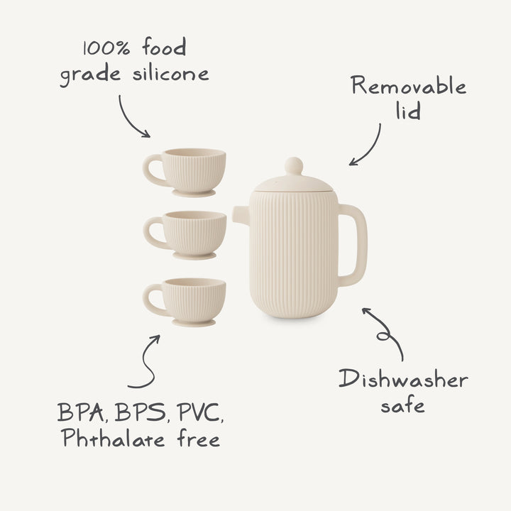 Product feature infographic for the Mushie silicone tea play set, highlighting that it is made from 100% food-grade silicone, is BPA, BPS, PVC, and phthalate-free, dishwasher safe, and features a removable lid.