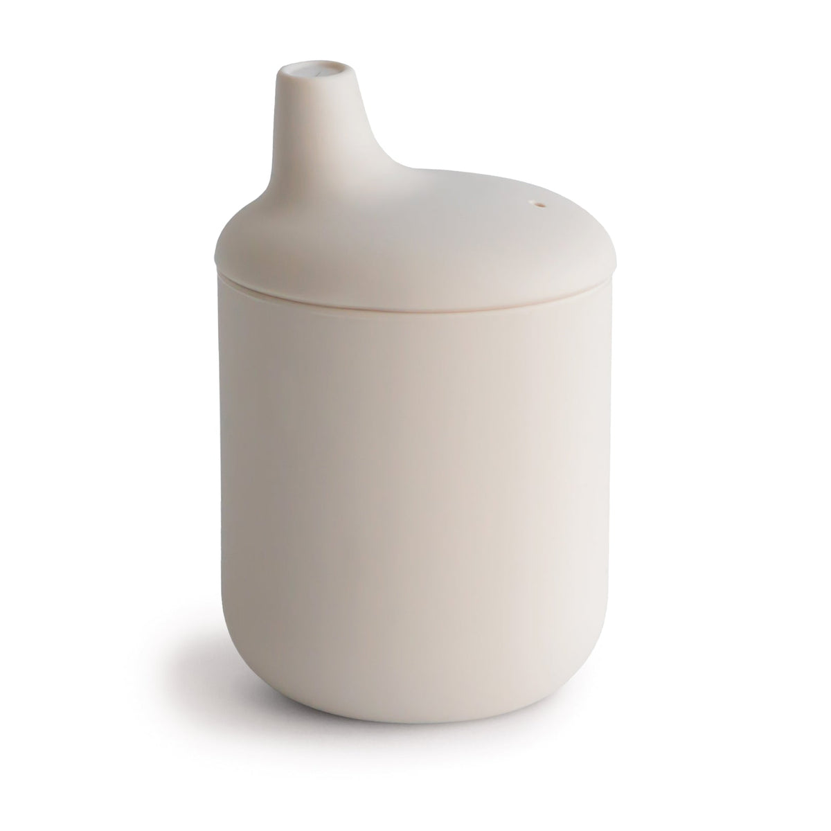Beige ceramic container with a lid on a white background