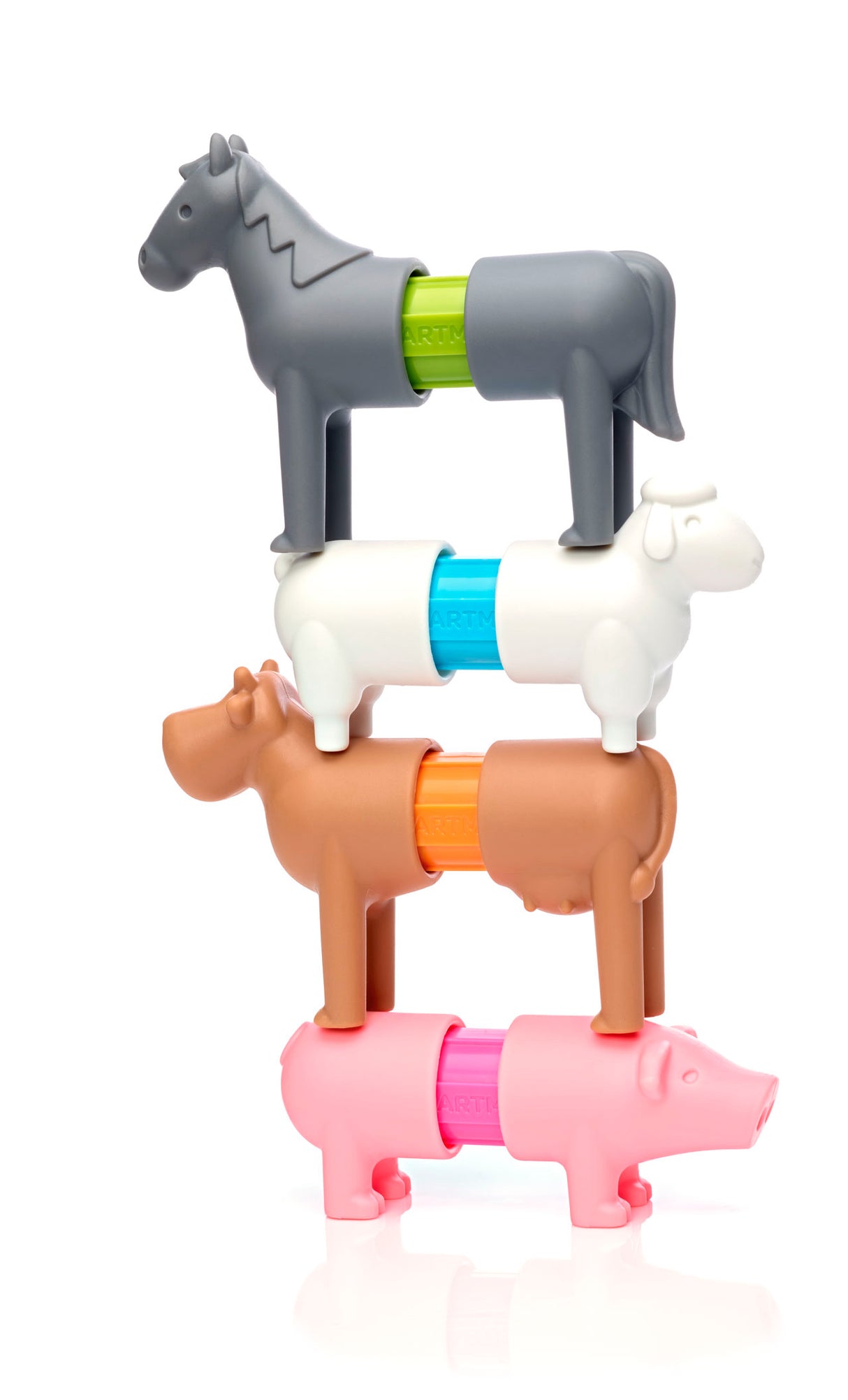 Stack of toy farm animals including a horse, cow, and pig on a white background
