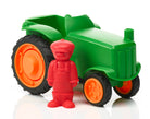 A green toy tractor with orange wheels standing next to a red farmer figure.