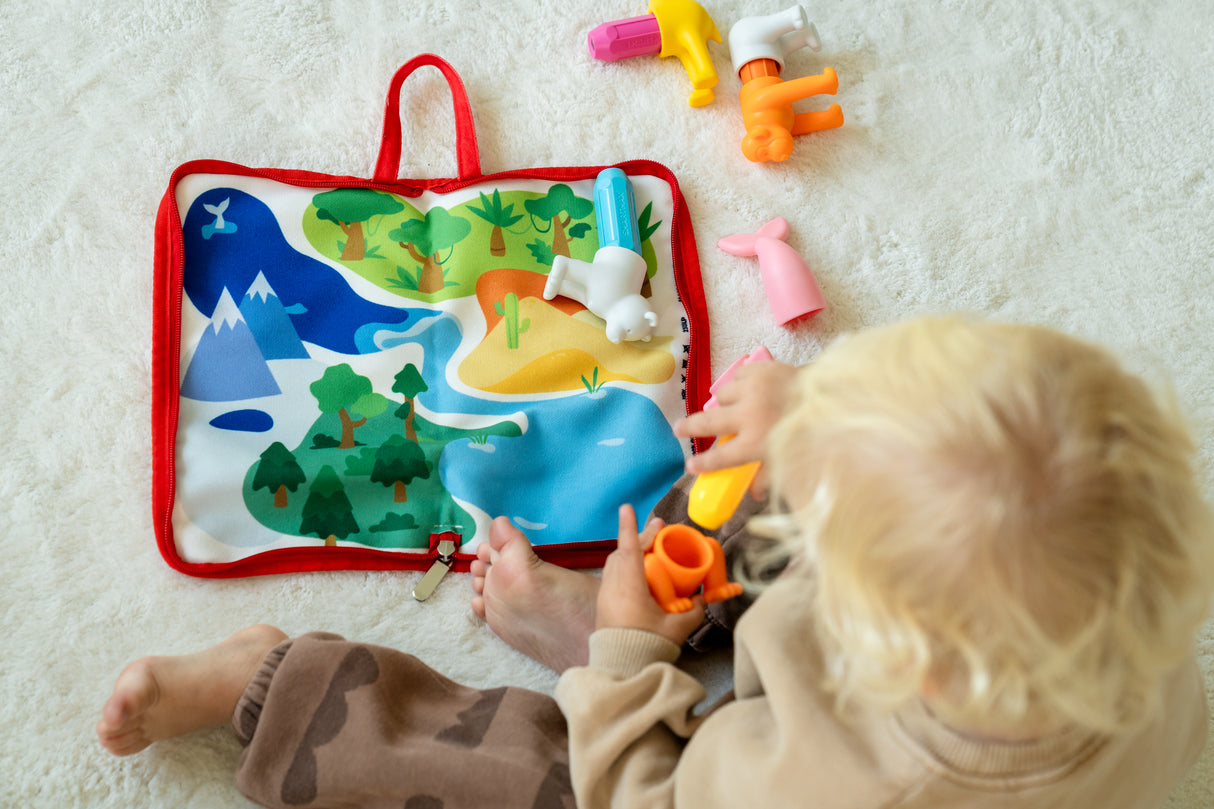 Child playing with a colorful educational toy on a light surface