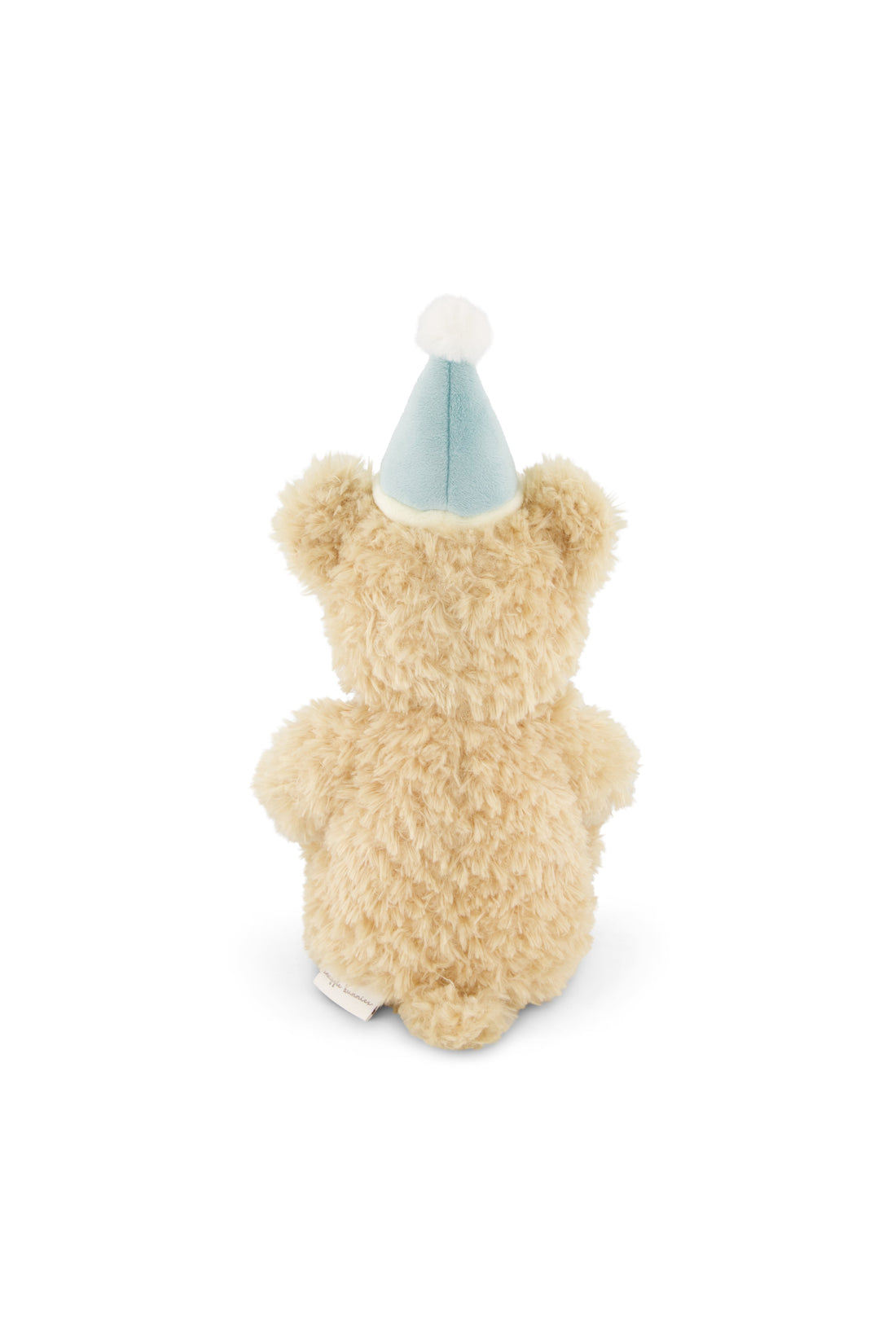 Small teddy bear wearing a blue party hat on a white background
