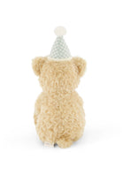 Plush bear toy with a party hat on a white background
