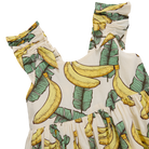 Dress with banana and leaf pattern on a white background