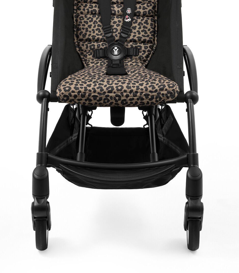 Black stroller with leopard print seat on a white background