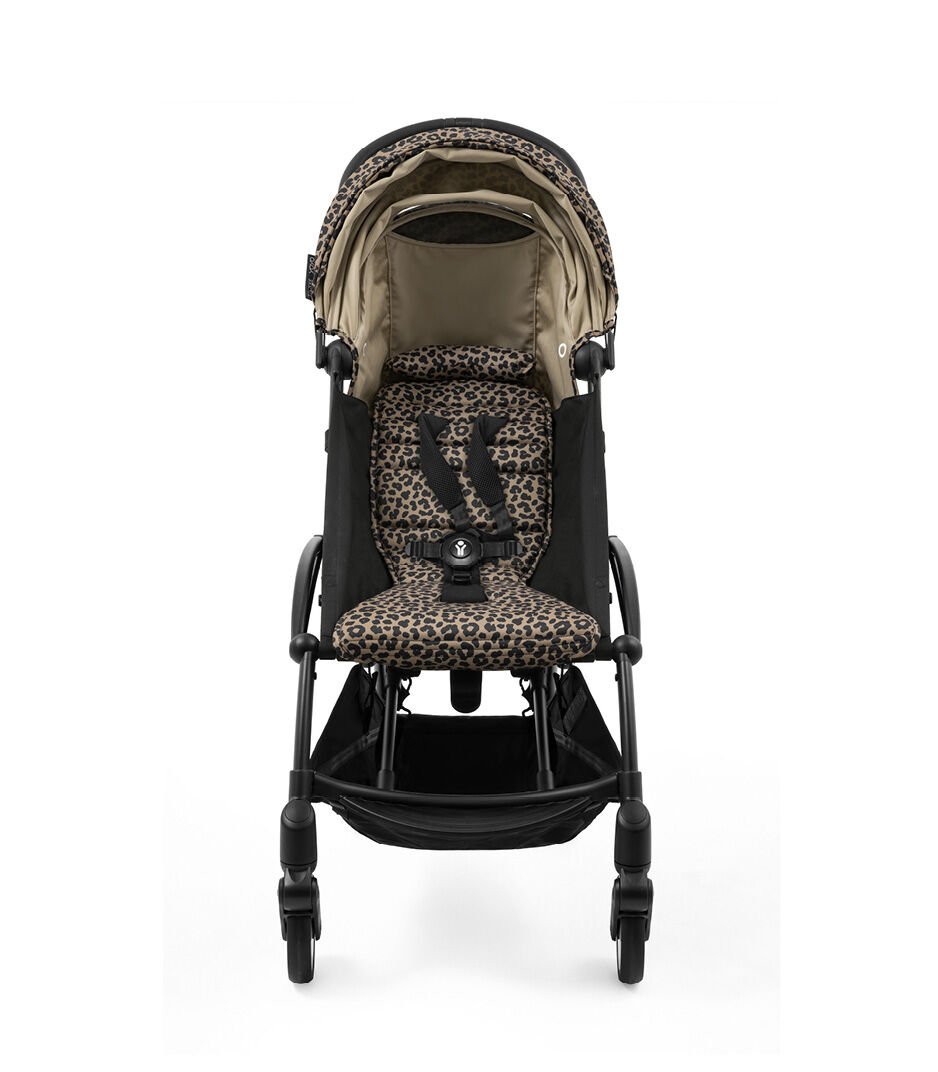 Baby stroller with leopard print seat on a white background