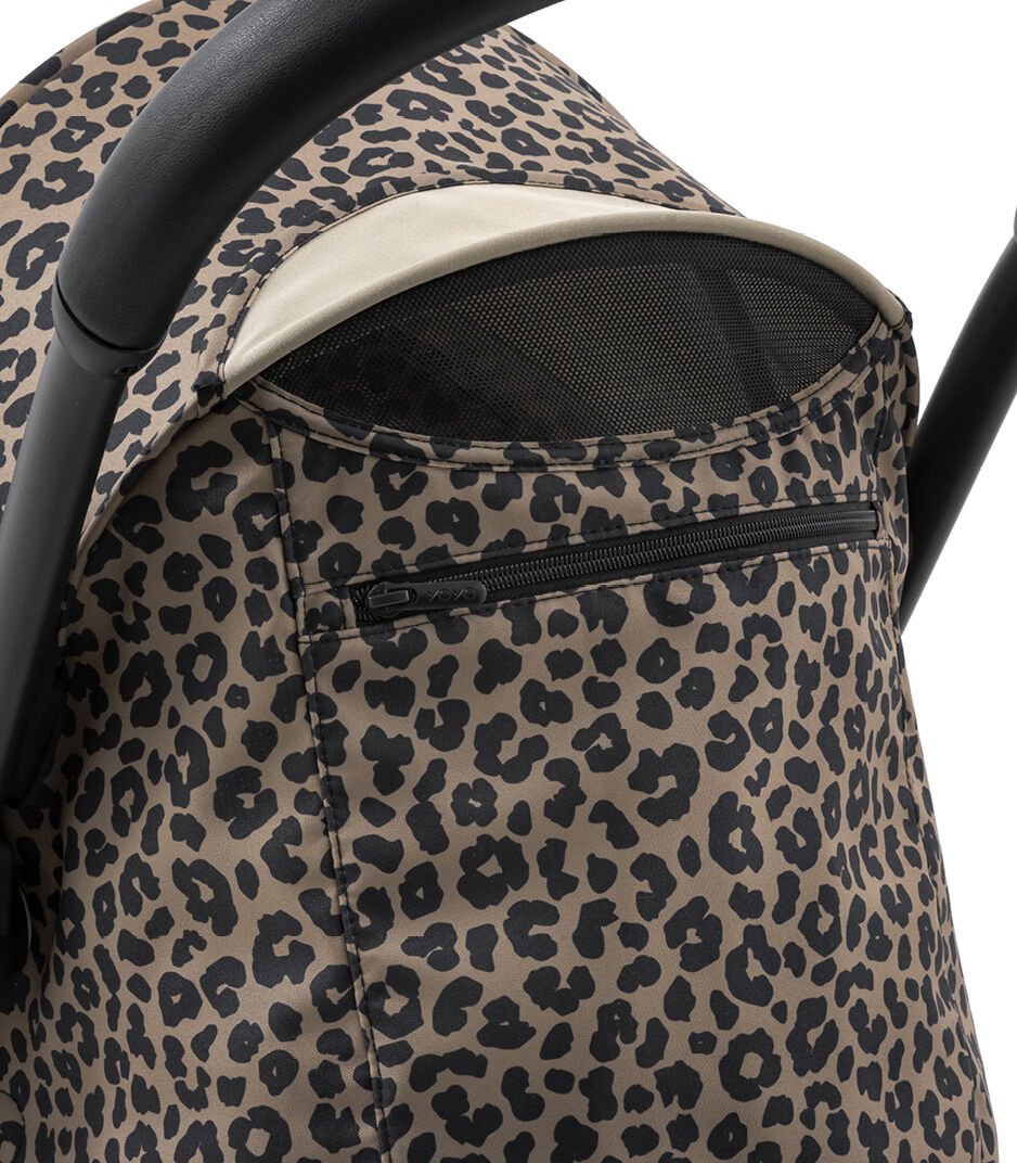 Leopard print baby stroller with beige interior on a white background