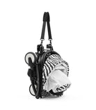 Baby stroller with zebra pattern canopy on a white background