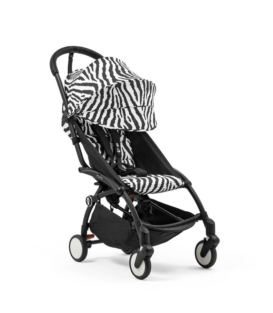 Black stroller with zebra-patterned canopy and seat cover on a white background