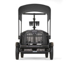 Black stroller viewed from the back on a white background