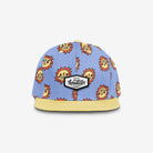 Blue cap with sun pattern and yellow brim on a white background