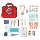 Children's toy doctor set with red bag, stethoscope, and various medical tools on a white background.