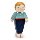 Wooden toy figure of a child wearing a blue shirt and dark pants on a white background