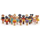 Set of wooden figurines representing diverse children on a white background