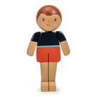 Wooden toy figure with a black and orange outfit on a white background