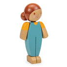 Wooden toy figure of a girl with brown hair, wearing a blue dress and yellow shirt on a white background.