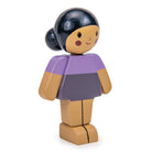 Wooden toy figure with a purple top and brown skirt on a white background