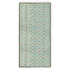 Patterned mat with small fish design on a light blue background