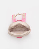 A small pink backpack shown from a top-down view, open to reveal a beige interior lining and light beige shoulder straps with gold-tone hardware, on a plain white background.